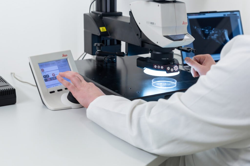 Engineer evaluating a sample at the measurement station in the QPS laboratory